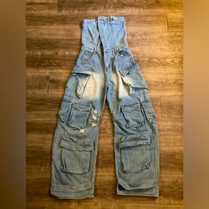Cargo women”s jumpsuit, light blue, baggy, faded on the middle, and the back.